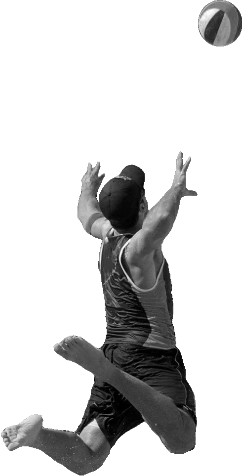 Beach volleyball player performing a jump serve